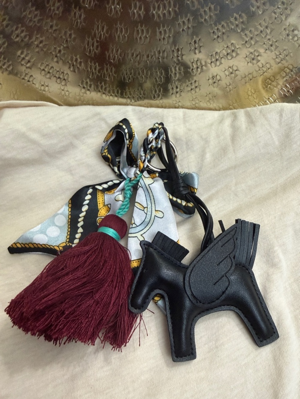Black Leather Pegasus Bag Charm with Burgundy Tassel and Scarf Accent